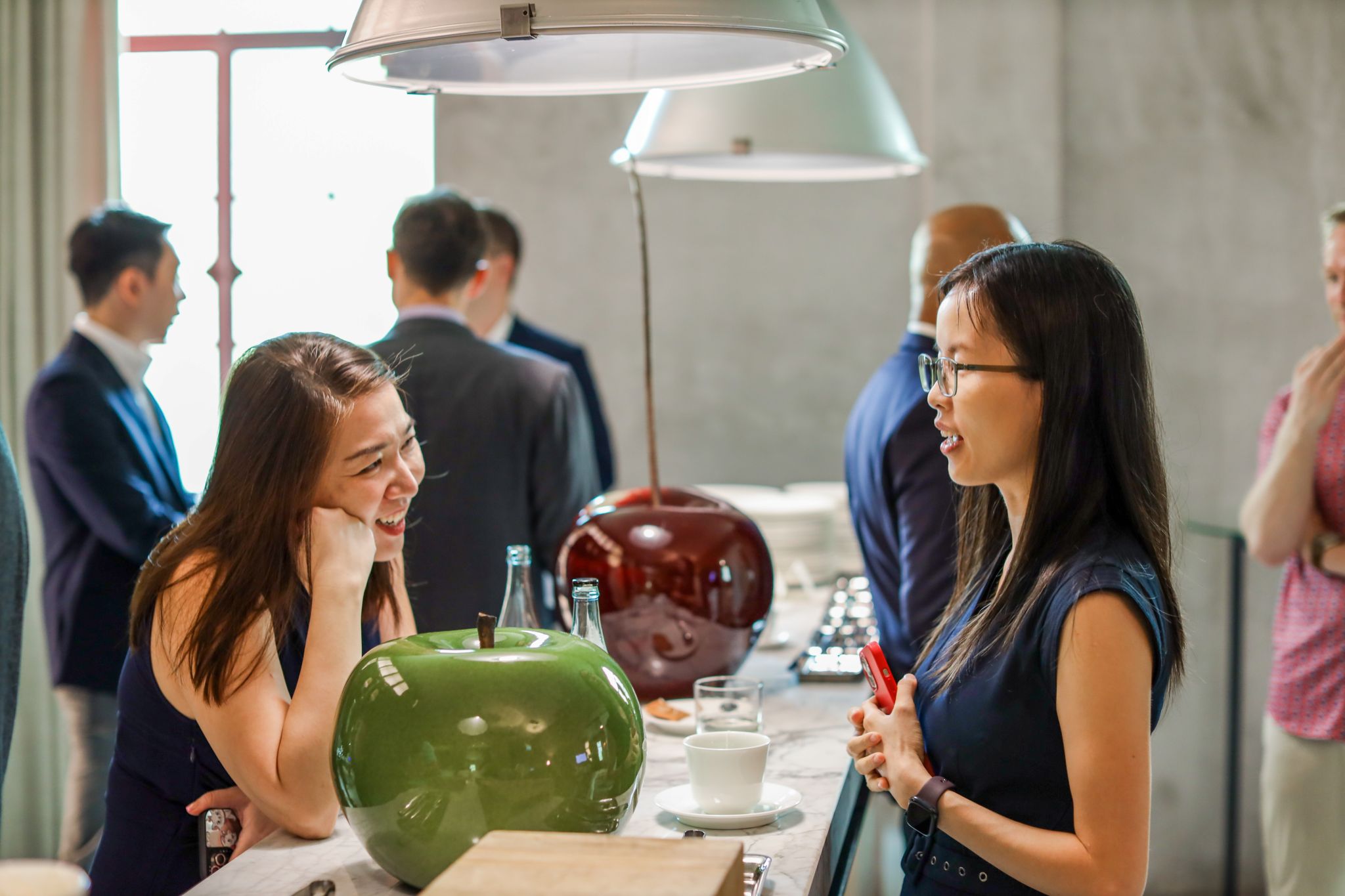 cover image of event - people dining in a corporate setting